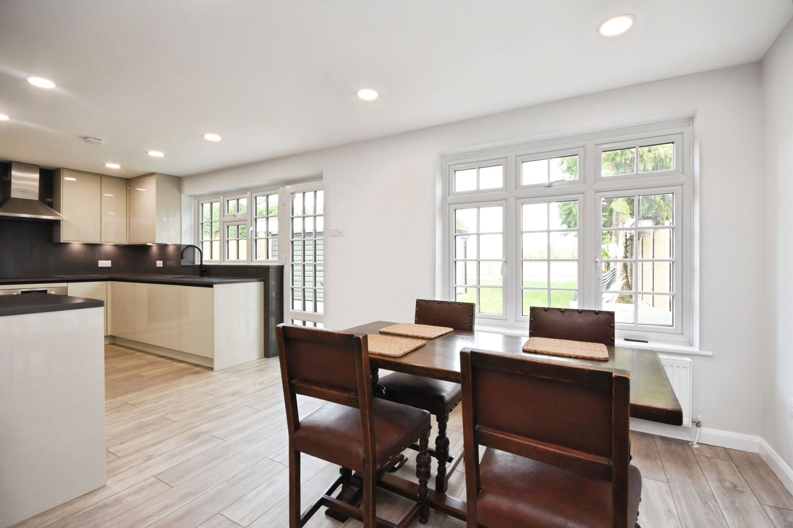Dining area with garden views through double cottage windows