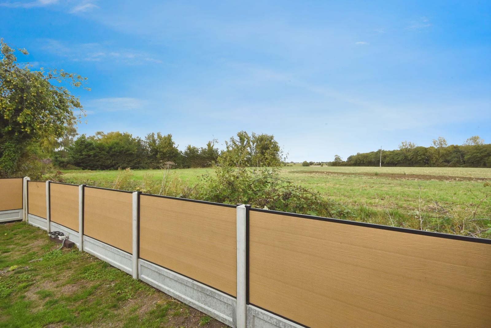 Open farmland beyond the rear garden fence