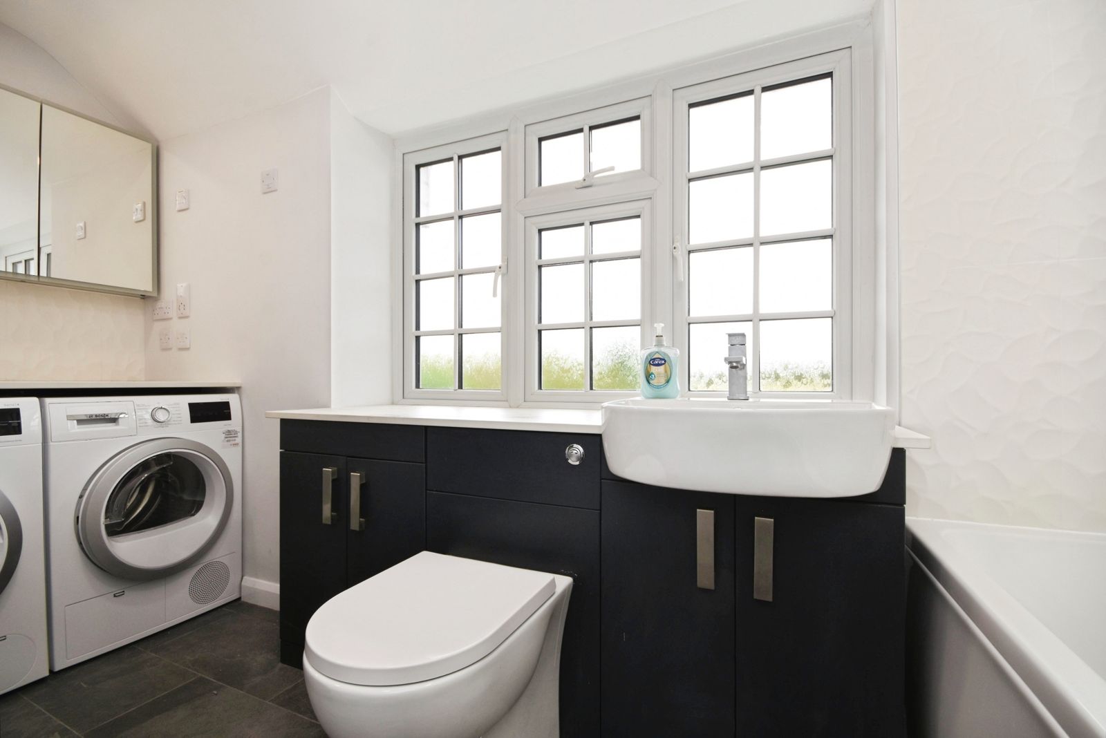 Laundry with washer, dryer and oversized countertop